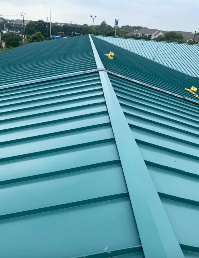 Green commercial metal roof ridge and valley for Metal Roof Repair in Nashua